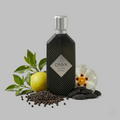 Khadlaj Onyx Silver perfume in a black bottle with a silver cap, surrounded by fresh lemon, green leaves, and flowers on a gray background.